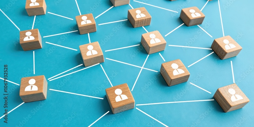 Wooden blocks with person icons connected by white lines on a blue background representing a network of people Wooden blocks with person icons connected by white lines on a blue background representing a network of people