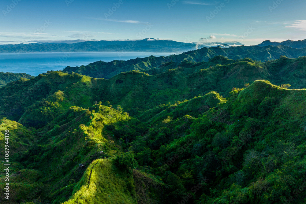 Naklejka premium Hill landscape with blue sky and clouds