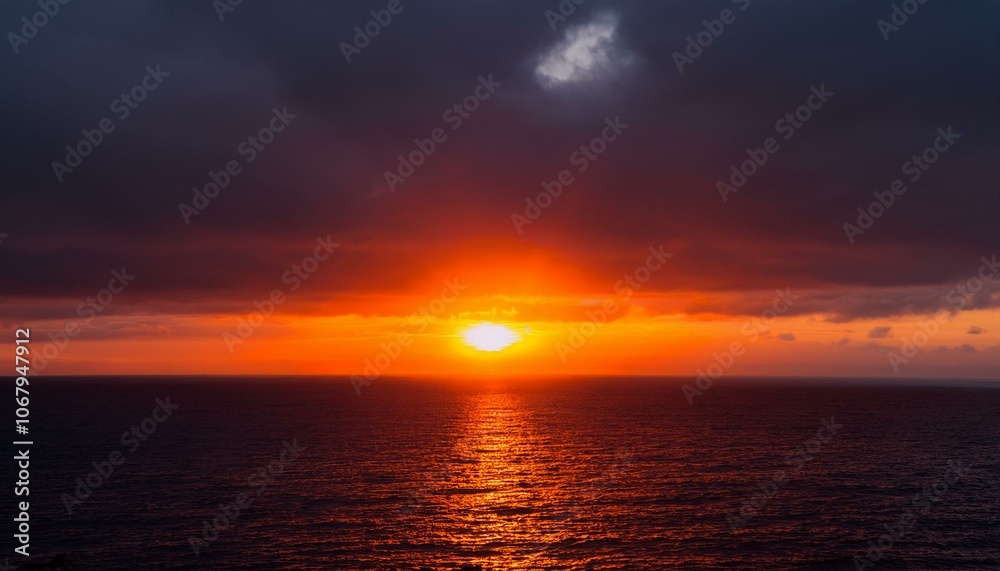 Fototapeta premium A big sun rises under the dark sky