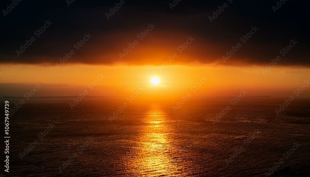 Fototapeta premium A big sun rises under the dark sky