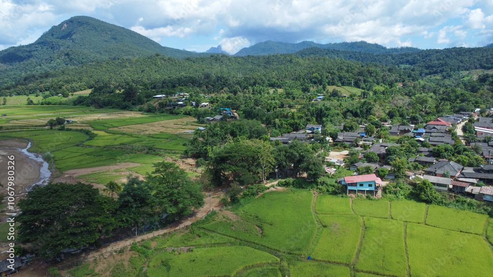 Village and rice fields in the foothill forest in northern Thailand Village and rice fields in the foothill forest in northern Thailand