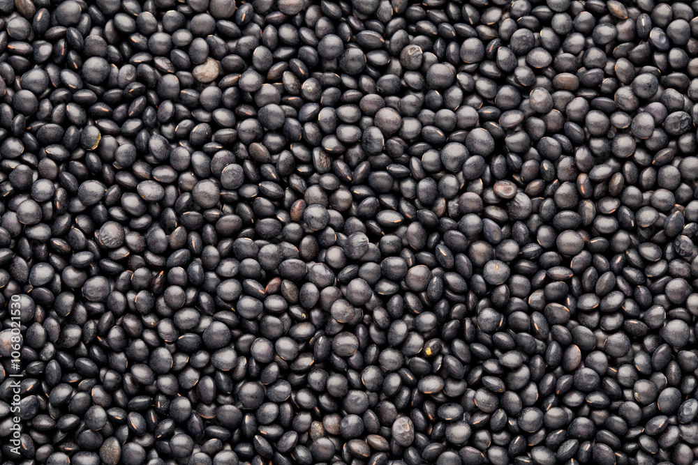 Food and cookery background of healthy dried black lentils. Food and cookery background of healthy dried black lentils.