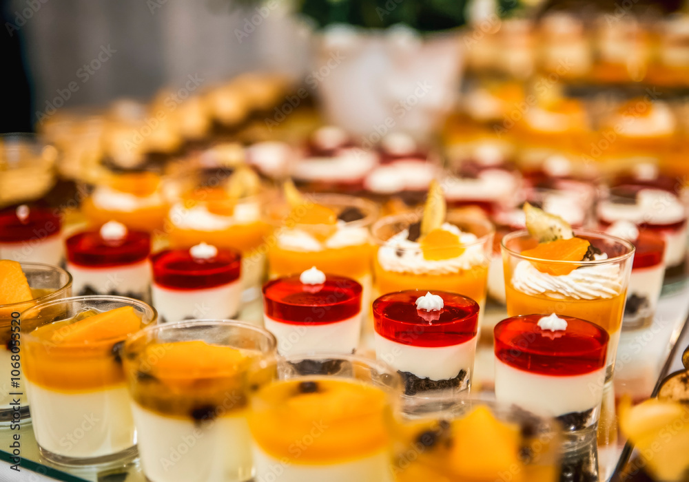 Decadent dessert array with fruit garnish for culinary events and catering displays Decadent dessert array with fruit garnish for culinary events and catering displays