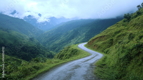 Tranquil countryside drive through verdant hills and dense forest.