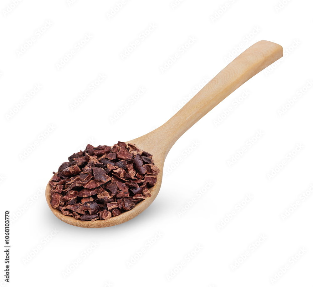 Cocoa nibs that are strong and have not undergone any processing other than roasting and shelling with a wooden spoon isolated on white background Cocoa nibs that are strong and have not undergone any processing other than roasting and shelling with a wooden spoon isolated on white background