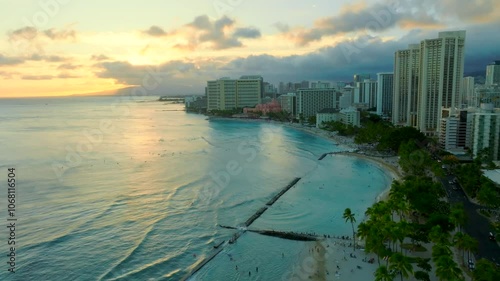 Drone flying over Waikiki beach during sunset at Honolulu Oahu Hawaii photo