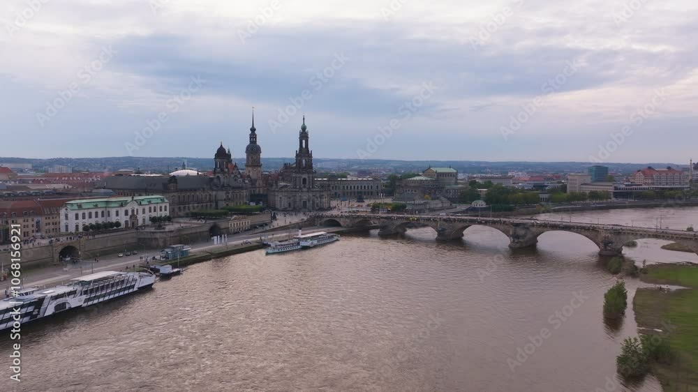 Aerial perspective of Dresden, showcasing the Augustus Bridge spanning the Elbe River and the iconic Church of Our Lady gracing the cityscape Aerial perspective of Dresden, showcasing the Augustus Bridge spanning the Elbe River and the iconic Church of Our Lady gracing the cityscape