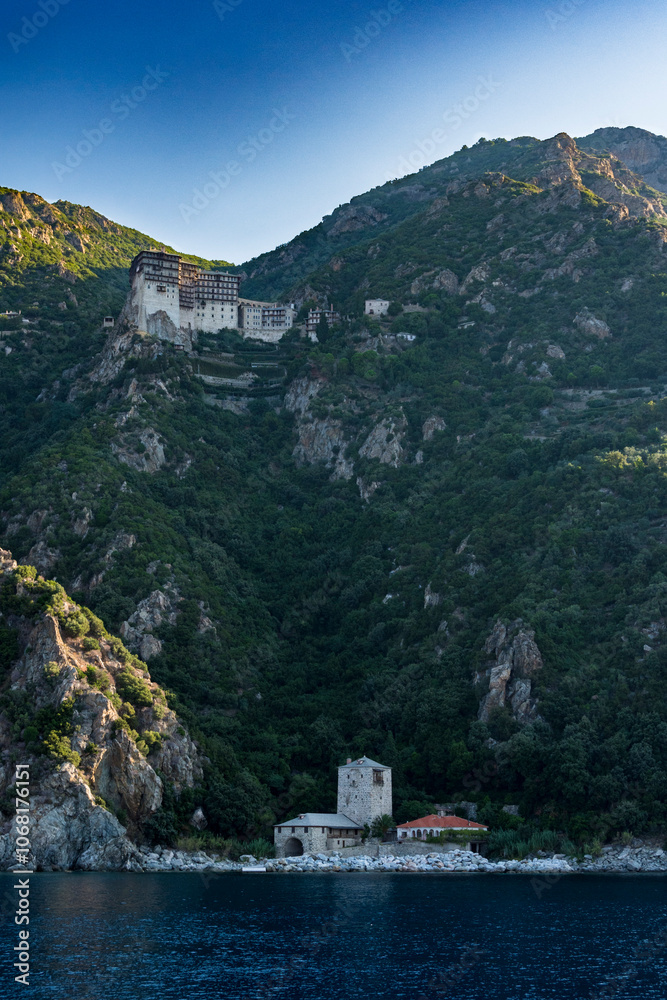 Fototapeta premium orthodox christian monastery sits on mountain side of mount athos