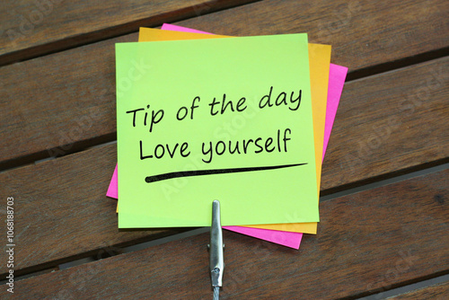 Tip of the day. Daily motivation reminder. daily motivation. sticky notes. Tip of the day Love yourself written on sticky notes