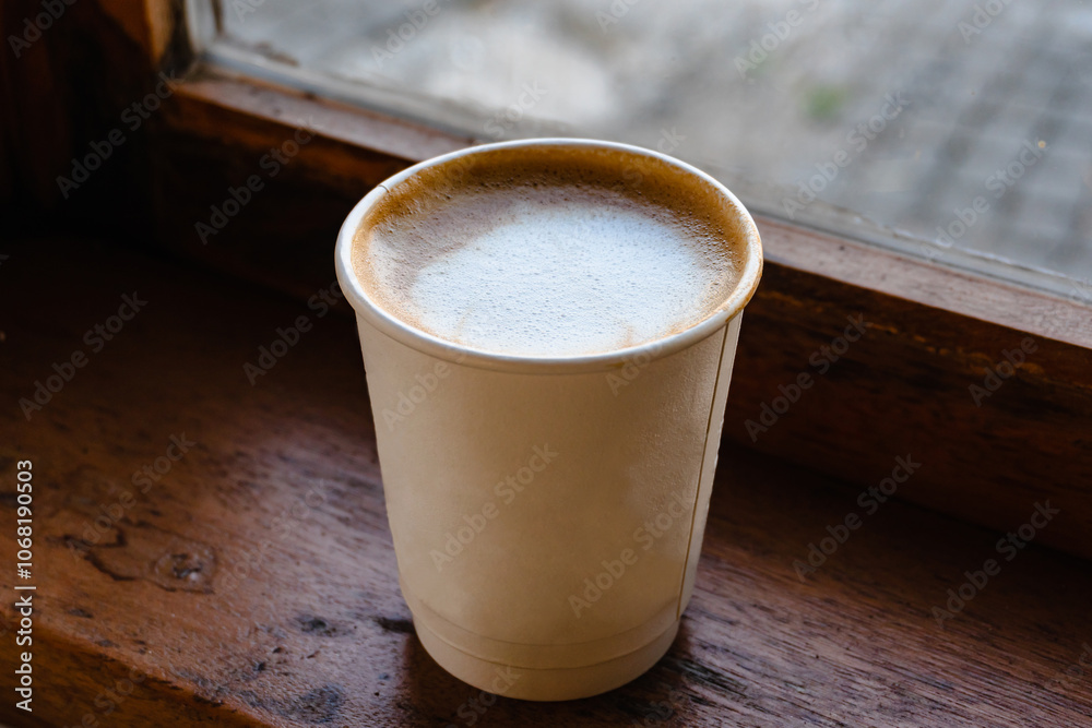 Paper cup of Coffee takeaway, top view. Wooden table and place for text. Paper cup of Coffee takeaway, top view. Wooden table and place for text.