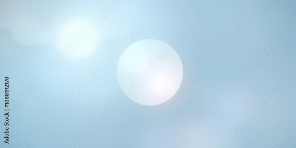 Soft blue and white abstract background with a light flare