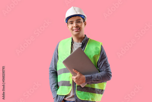 Young male worker in eyegla...