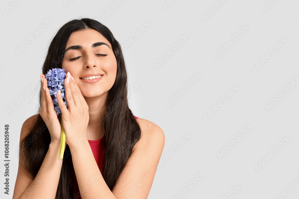Pretty young woman with hyacinth flower on white background Pretty young woman with hyacinth flower on white background