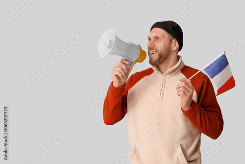 Young man with flag of Fran...