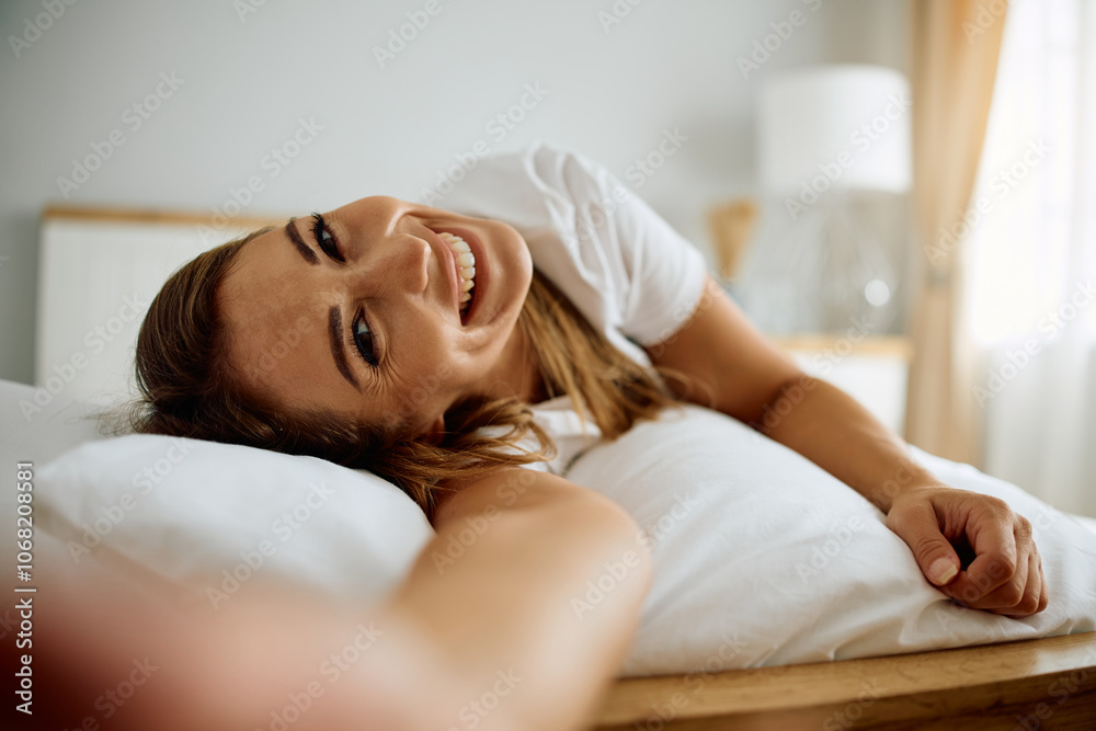 Carefree woman taking selfie in morning and looking at camera. Carefree woman taking selfie in morning and looking at camera.
