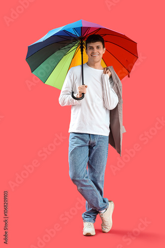 Smiling young man holding c...