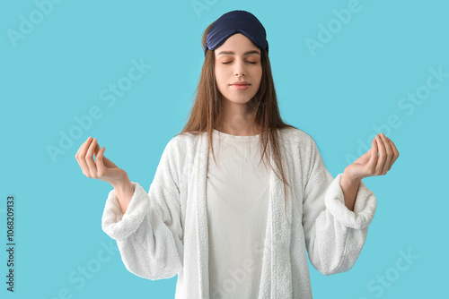 Young woman in pajamas and ...