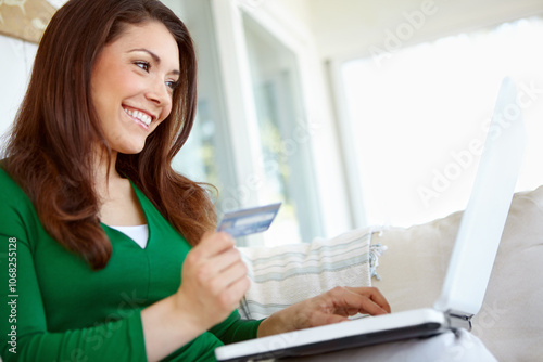 Woman, debit card and laptop for home purchase, banking website and online for credit score. Female person, checkout service and pay for order on app, subscription bills and transfer money to account