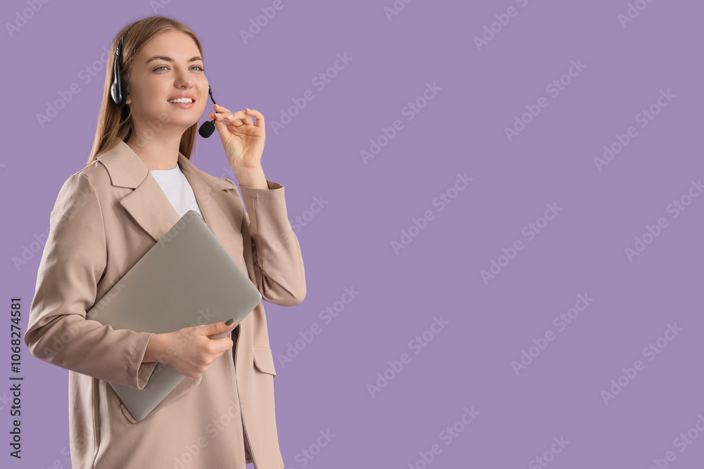 Female technical support agent in headset with laptop on lilac background Female technical support agent in headset with laptop on lilac background