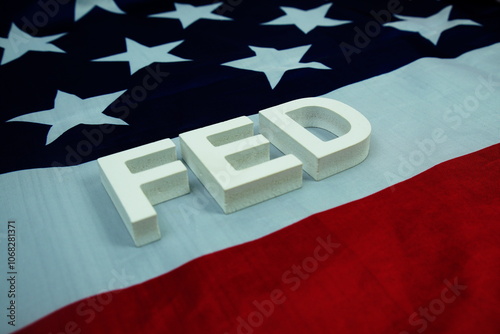 The Federal Reserve (FED) alphabet letters with USA flag background, Economy and Business concept photo