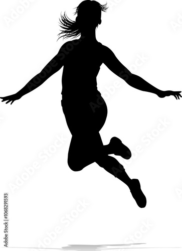 A happy woman jumping for joy in mid air silhouette person concept