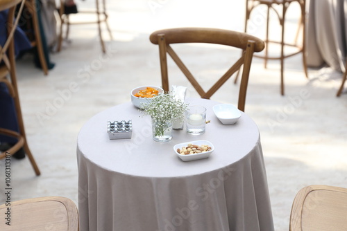 Simple and elegant outdoor table setting with snacks photo