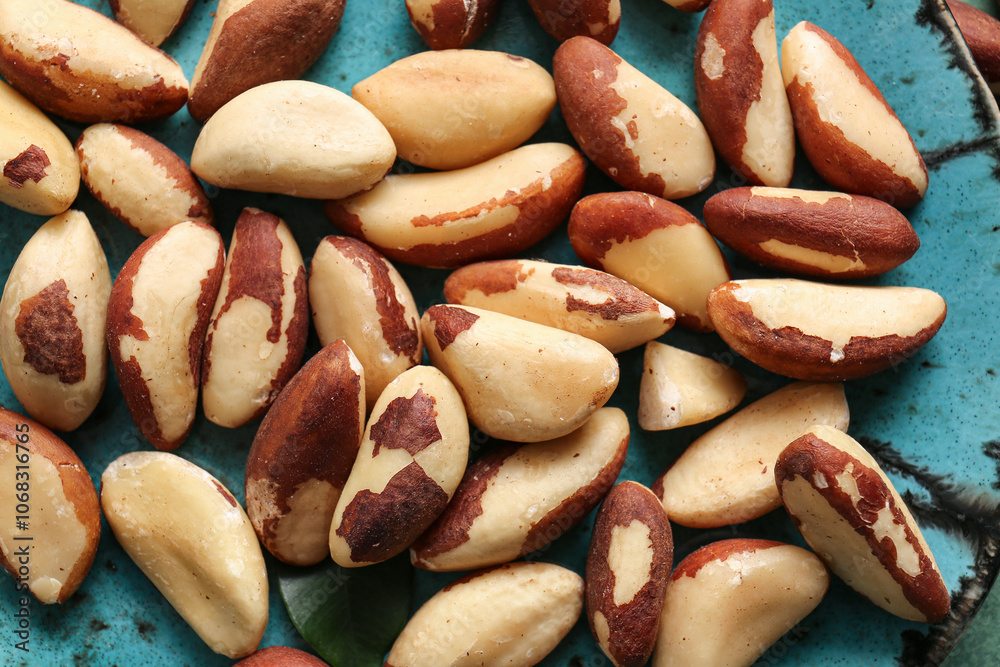Obraz premium Plate with tasty Brazil nuts, closeup