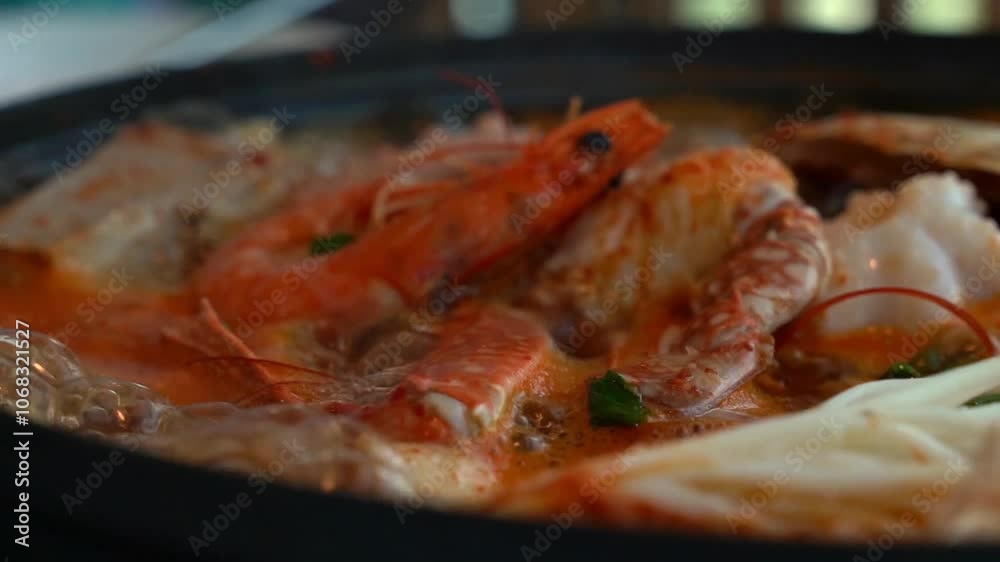 Tofu seafood soup with seafood such as clams and blue crabs and vegetables such as mushrooms Tofu seafood soup with seafood such as clams and blue crabs and vegetables such as mushrooms