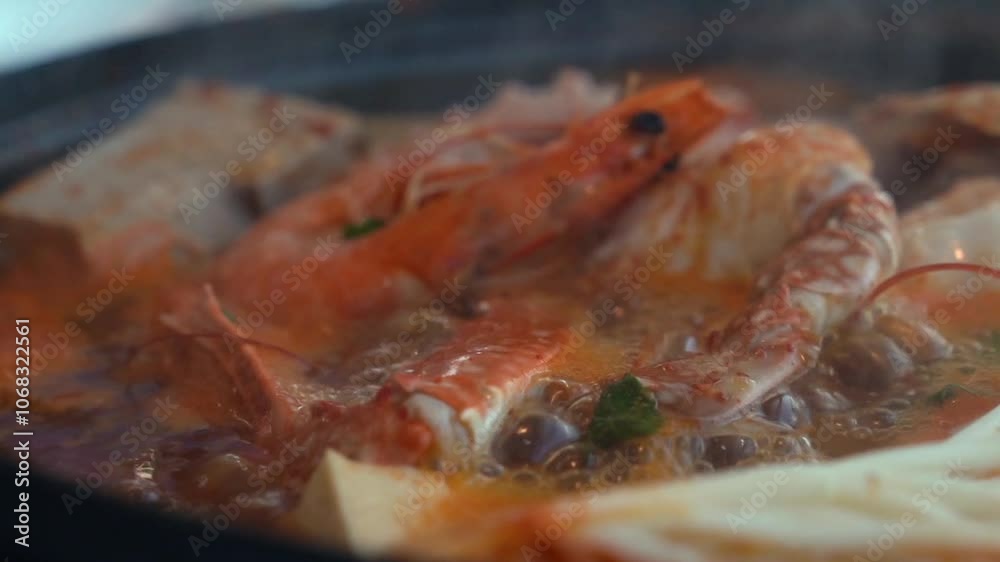 Tofu seafood soup with seafood such as clams and blue crabs and vegetables such as mushrooms Tofu seafood soup with seafood such as clams and blue crabs and vegetables such as mushrooms