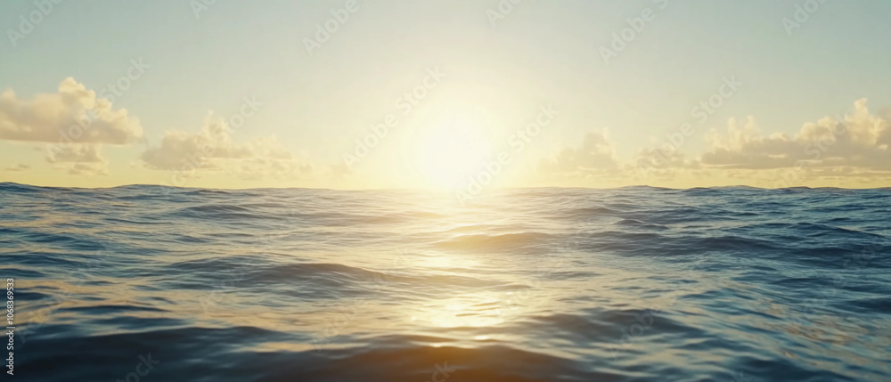 Golden Sunrise over Ocean Waves with Warm Light and Soft Clouds Golden Sunrise over Ocean Waves with Warm Light and Soft Clouds