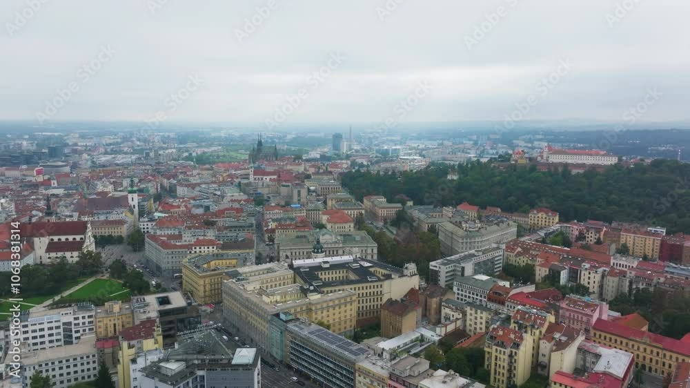 Aerial views showcase the czech city of Brno, highlighting its distinctive architecture and green parks beneath a cloudy sky, blending urban life with natural beauty Aerial views showcase the czech city of Brno, highlighting its distinctive architecture and green parks beneath a cloudy sky, blending urban life with natural beauty
