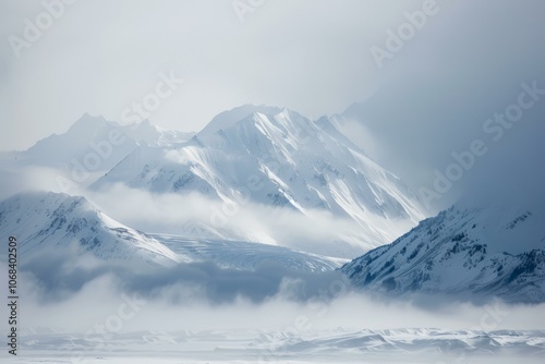 Wallpaper Mural Low clouds are flowing over a snow covered mountain range on a cold winter day Torontodigital.ca