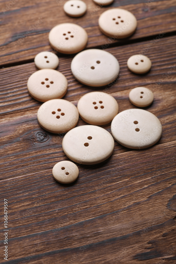 Wooden buttons on a wooden background Wooden buttons on a wooden background