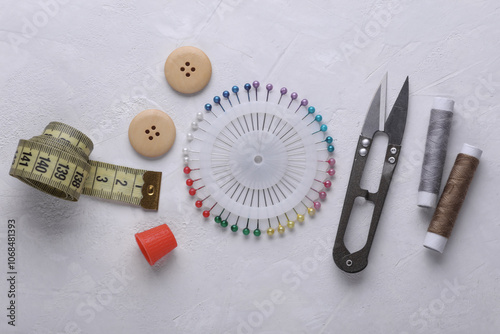 Tailor sewing accessories on concrete background