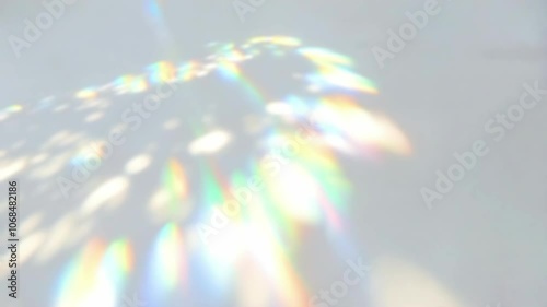 Rainbow Light and Shadow Overlay Effect on White Background. Abstract Colorful Refraction, Trendy Visuals. 4K Video
