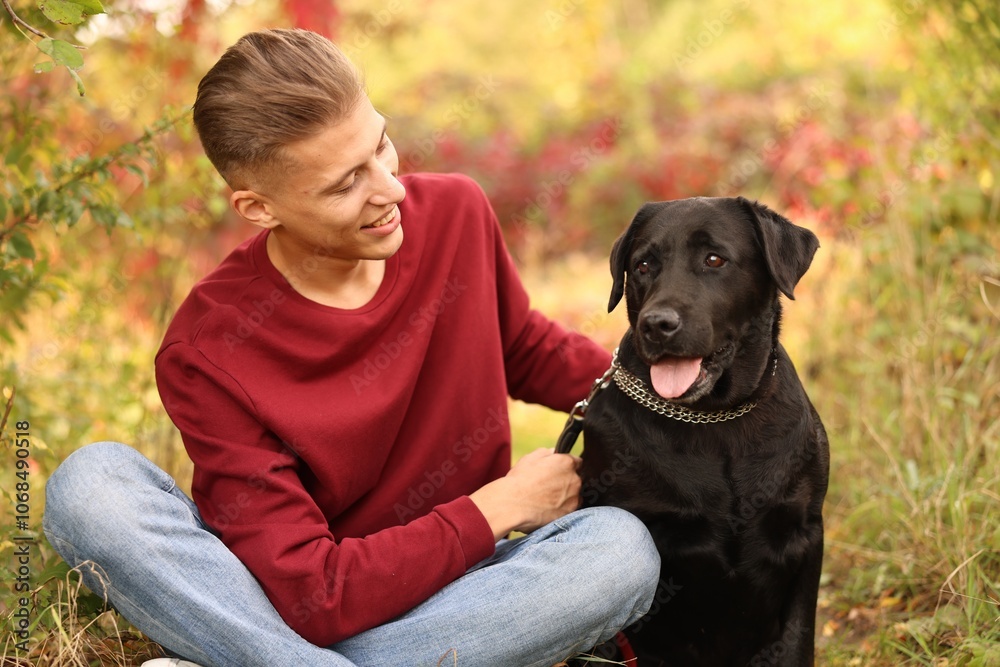 Smiling man with cute dog outdoors on autumn day Smiling man with cute dog outdoors on autumn day