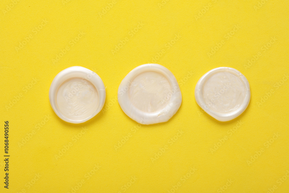Mockup of white wax seals on yellow background Mockup of white wax seals on yellow background