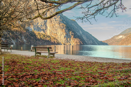 In autumn, Germany’s Königssee becomes a serene mirror, reflecting fiery trees and rugged peaks. At its end, the idyllic St. Bartholomä Church stands in quiet beauty, a timeless lakeside gem. photo