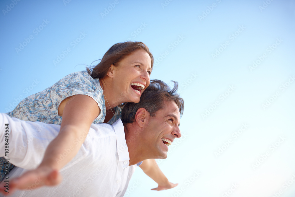 Fototapeta premium Piggyback, embrace and couple with smile, outdoor and holiday for romance, date and happy in relationship. Freedom, man and woman on vacation, bonding and commitment in marriage, mockup and travel