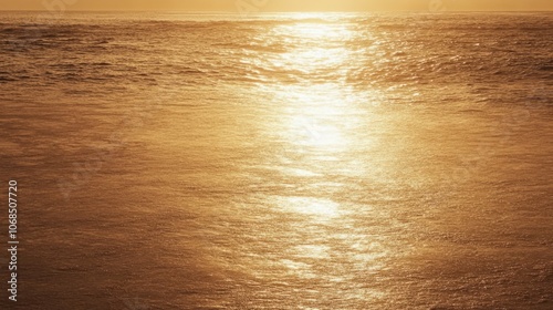 Golden November sunset over the Atlantic, casting warm light on an empty shoreline