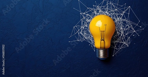 A yellow bulb in a spider web on a blue background