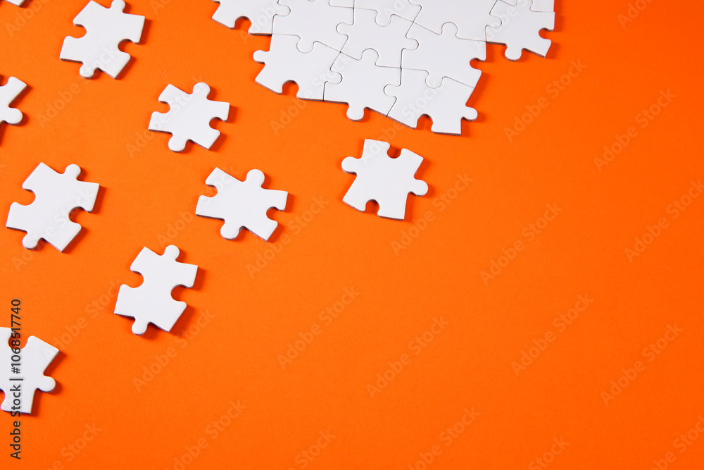 Puzzle Pieces on Orange Background Puzzle Pieces on Orange Background
