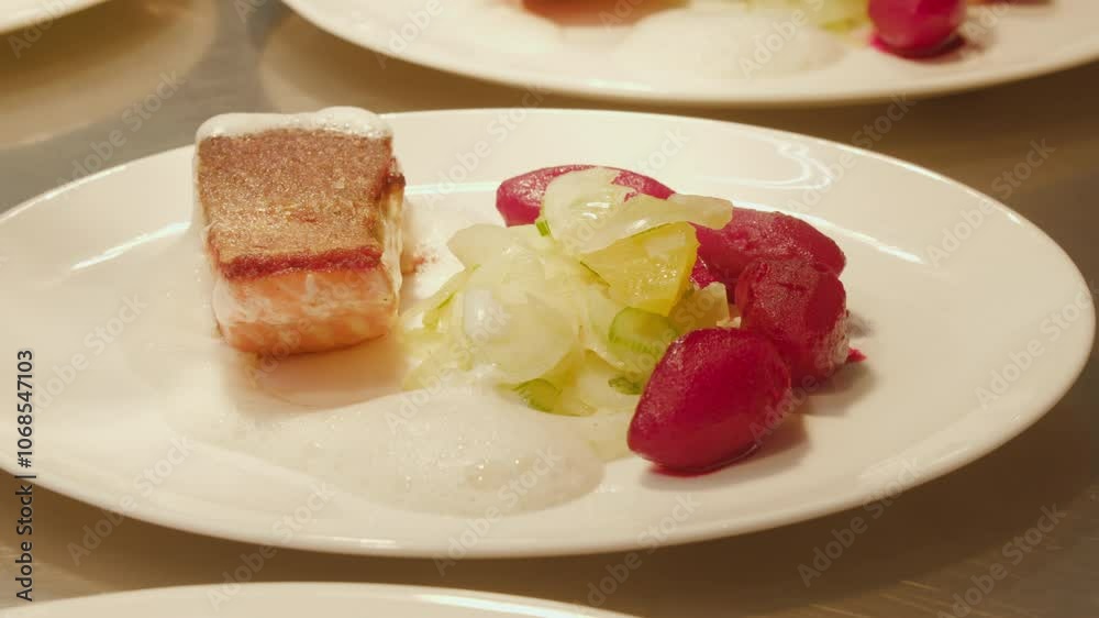 Chef crafts exquisite dish with foam garnish in upscale restaurant. Ideal for culinary shows and gastronomy projects. Chef crafts exquisite dish with foam garnish in upscale restaurant. Ideal for culinary shows and gastronomy projects.