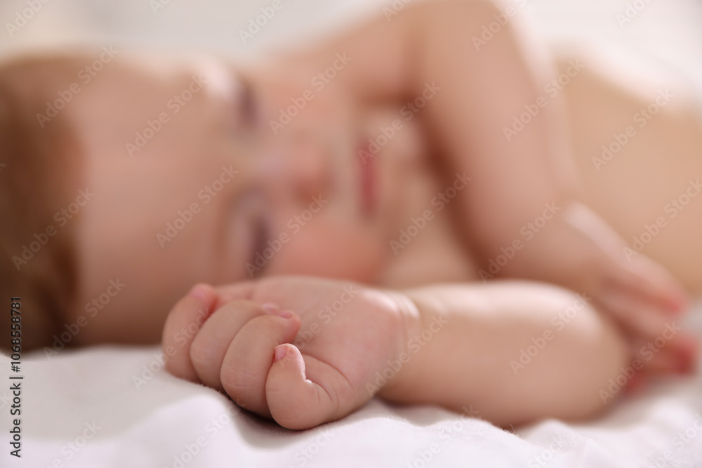 Cute little baby sleeping on bed, selective focus Cute little baby sleeping on bed, selective focus