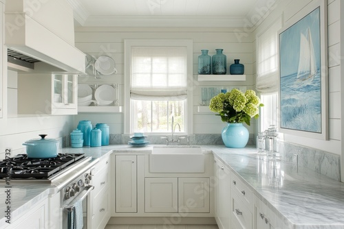Coastal-inspired Kitchen with White Cabinets and Marble Countertops