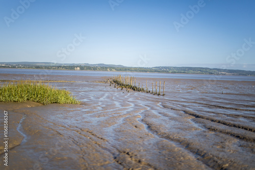 Low tide at muddy river Severn ripples of mud.