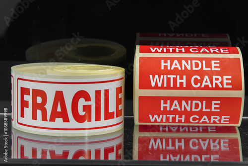 Fragile Handle With Care Sticker roll. Warning labels stickers tape