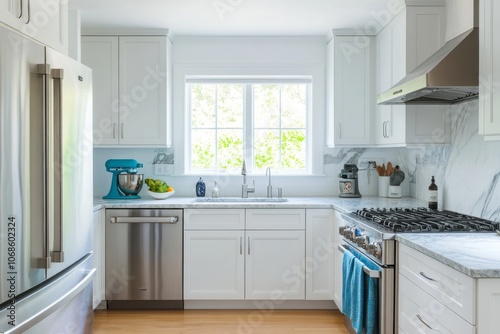 Modern White Kitchen with Stainless Steel Appliances and Window View