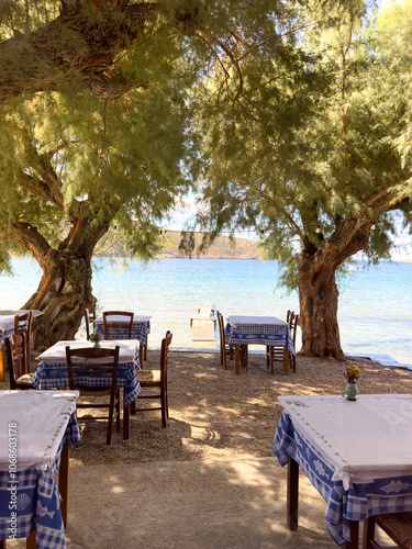 A restaurant on Vathi Beach, Sifnos. The beach stretches for more than 1 km and is a very popular place for sailboats to stop with its perfect sheltered harbour