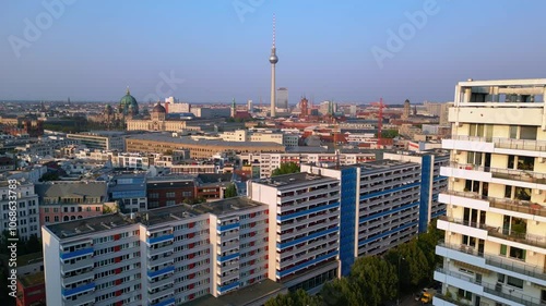 berlin cityscape with iconic landmarks tv tower, dom, Red town hall and Central Committee of the SED bathed in golden light. Best aerial view flight descending drone photo